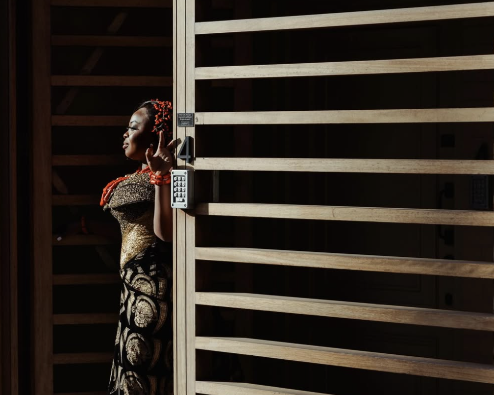 Cinematic portrait of a woman in low light studio setting, representing luxury photography